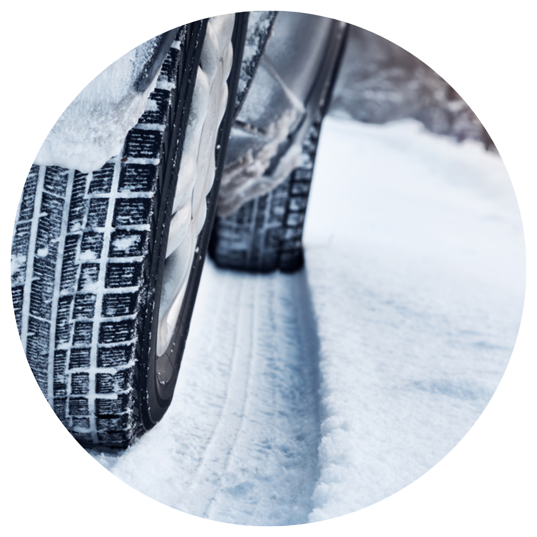 car with winter tires driving on snow 